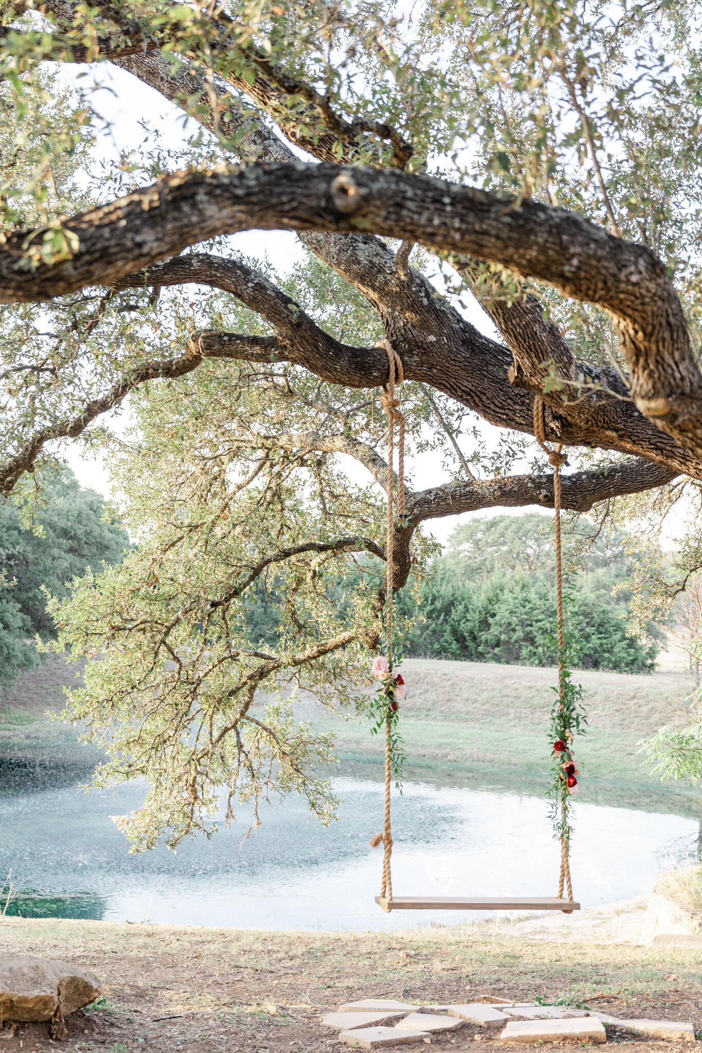 The wooden swing next to the Acre 31 lake.